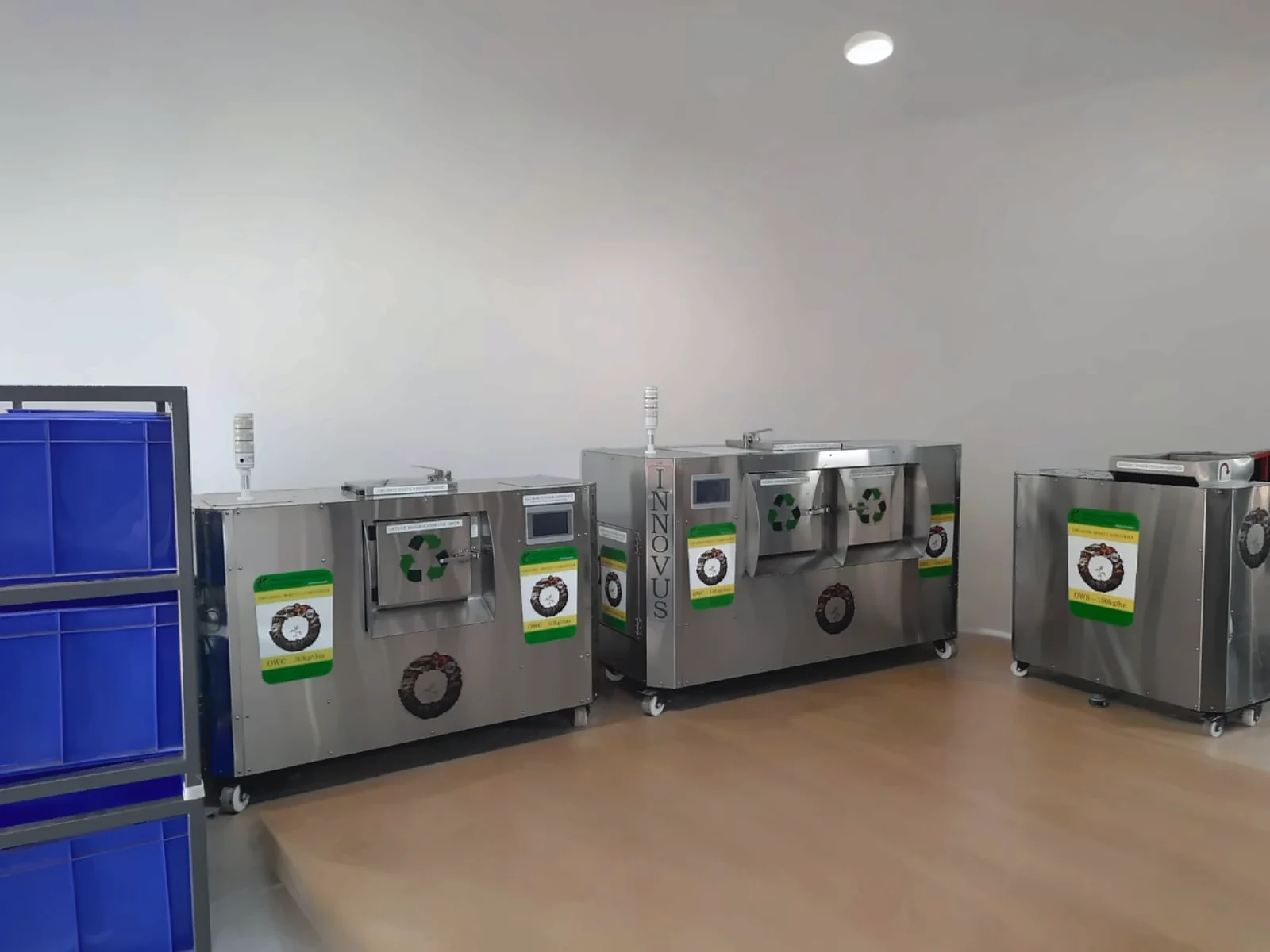 Innovus composters and a shredder in a residential waste room