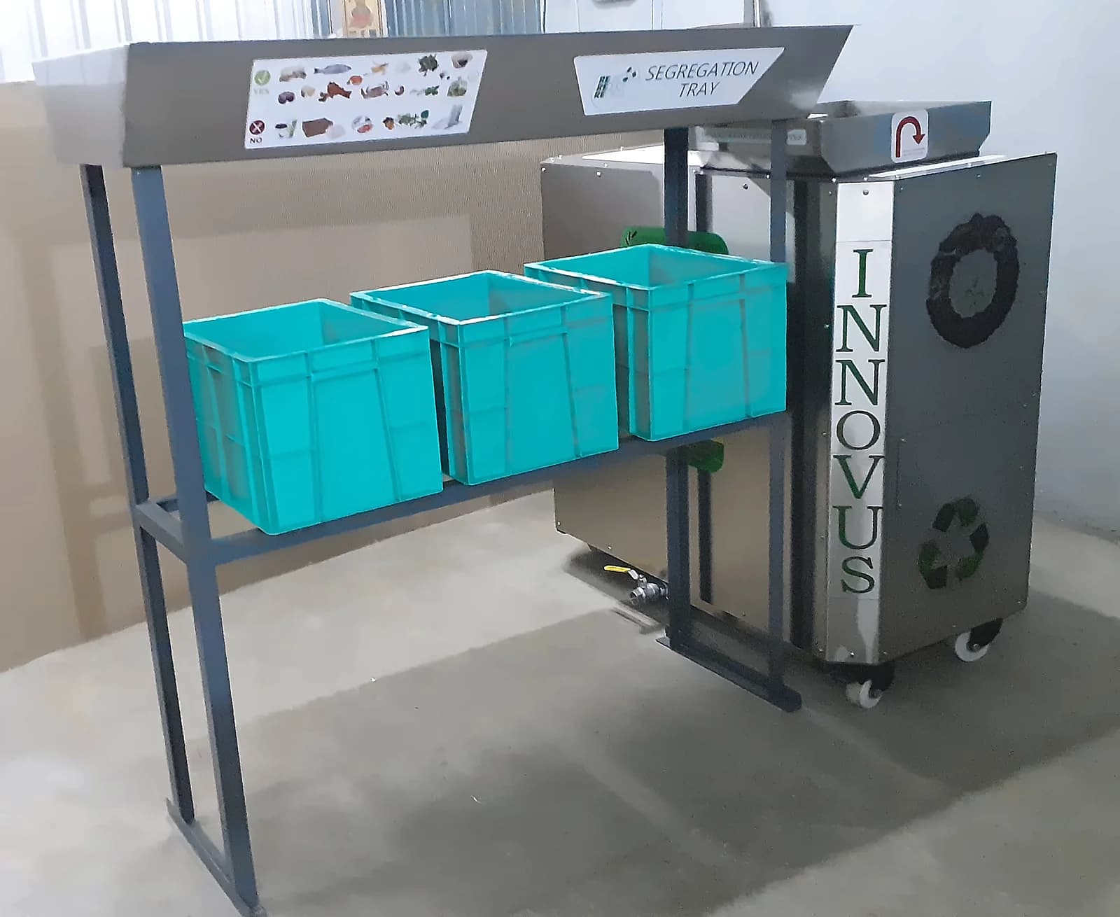 Innovus shredder with a segregation tray over its feed and crates below