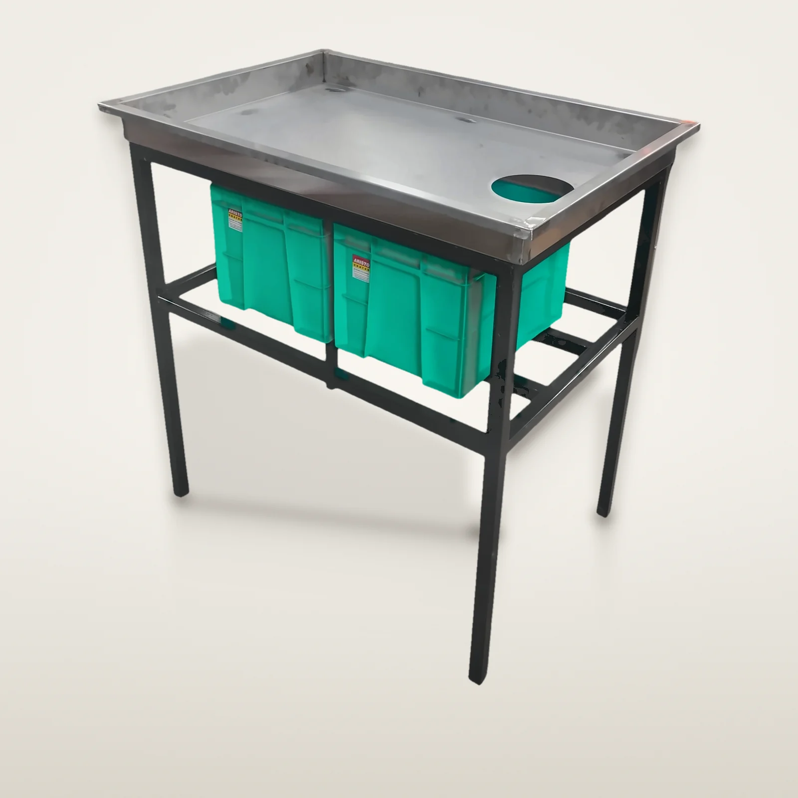 Segregation table with a reject hole in the stainless tray and two crates on the frame below